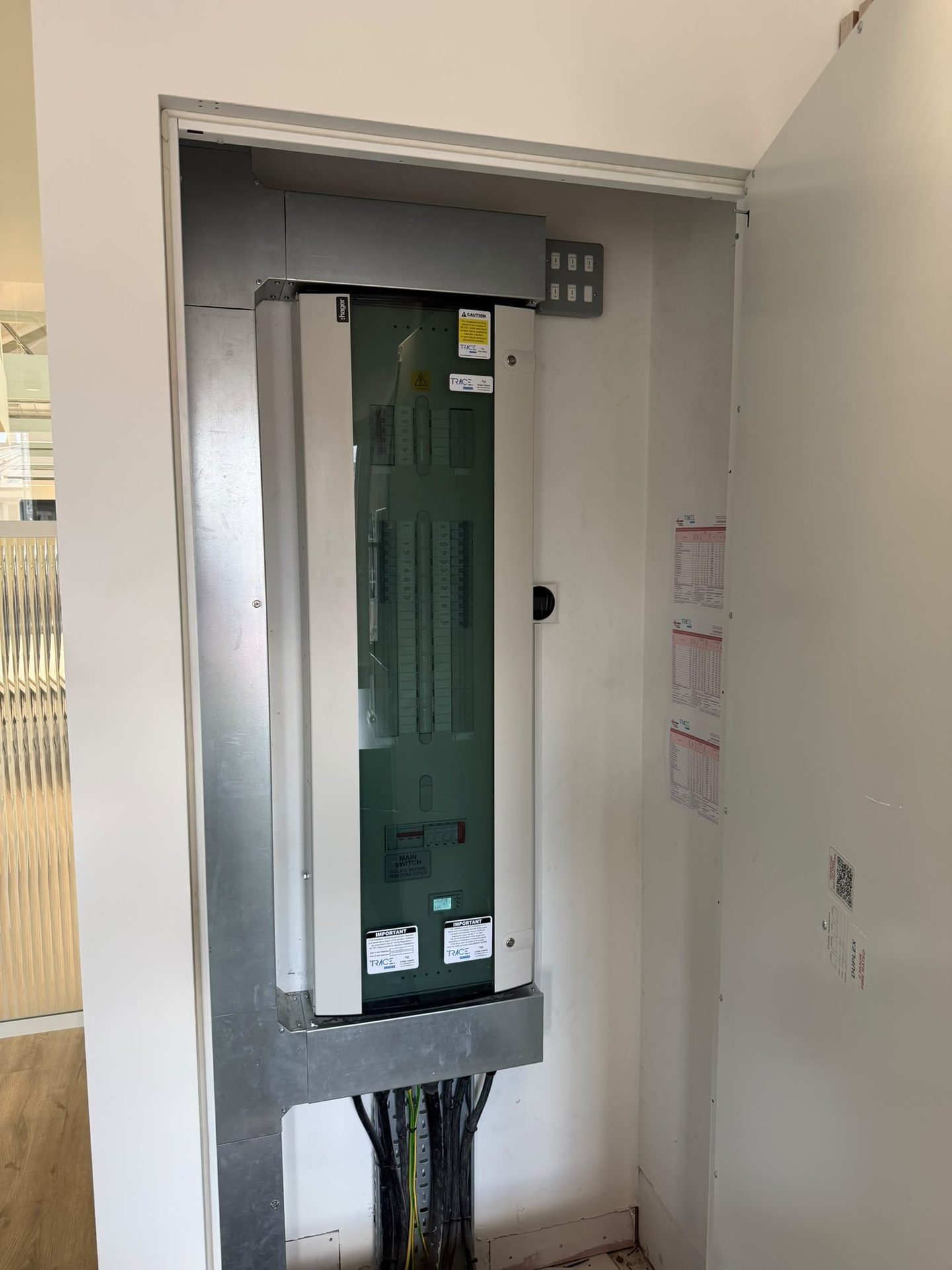 New Hager consumer unit with RCBO protection installed, labelled and tested in a domestic cupboard