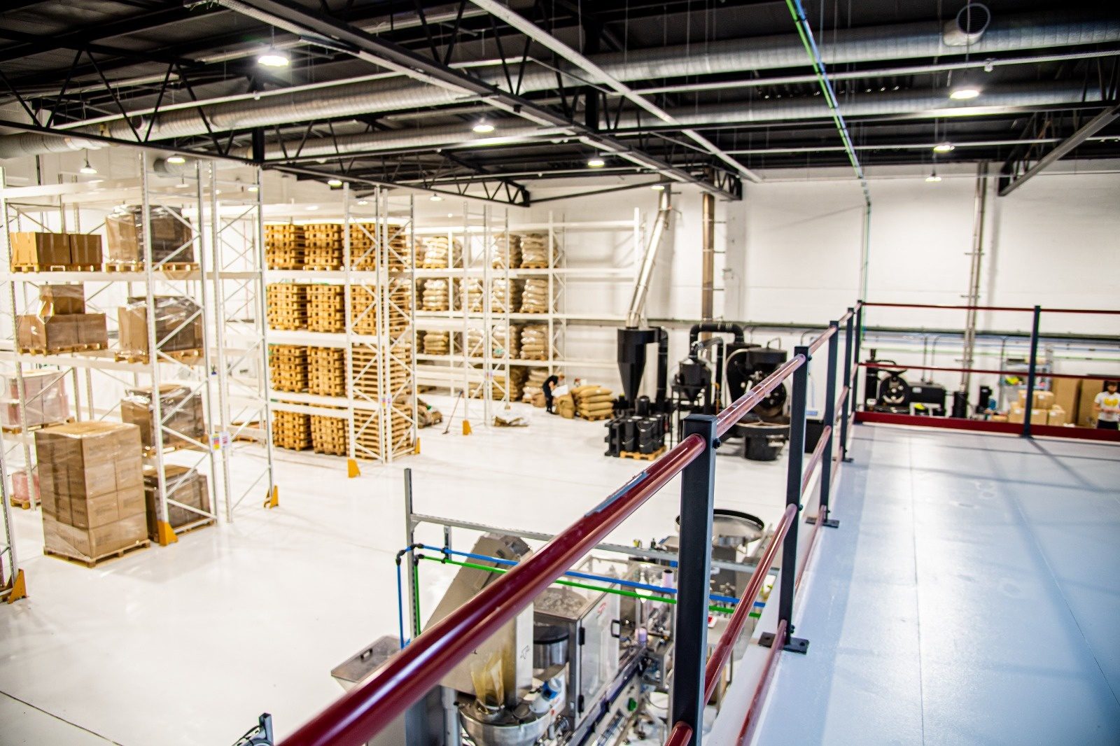 Industrial production floor lighting and machinery power inspected during a planned maintenance visit