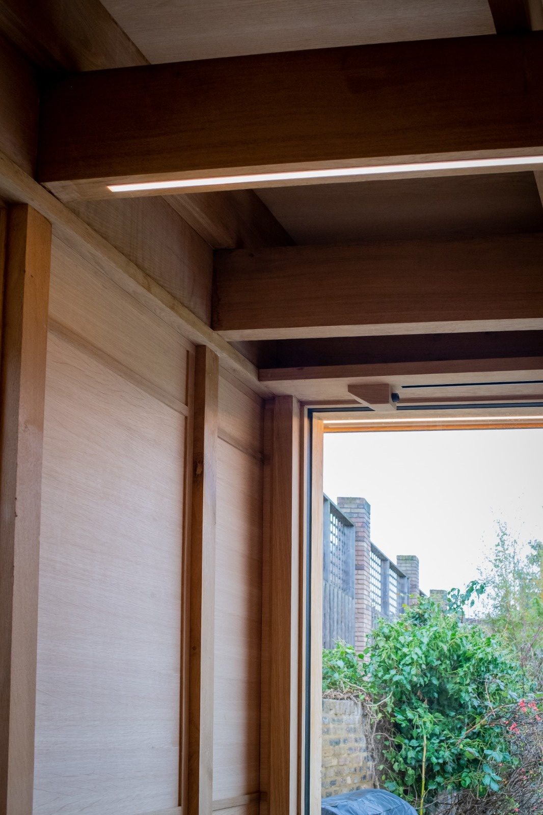 Concealed LED strip lighting wired into an oak-framed extension by Trace Electrical