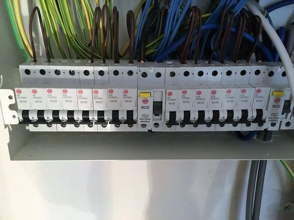 Upgraded consumer unit with RCD protection and labelled MCBs, neatly wired and terminated ready for testing