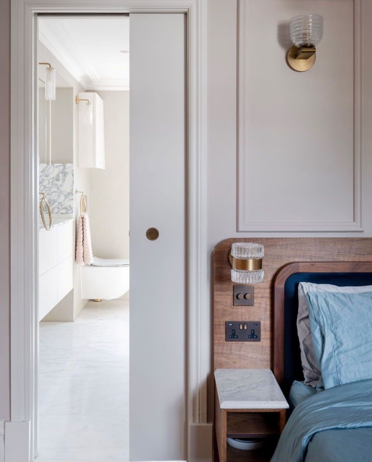 Smart bedside lighting with dimmer switches and USB sockets installed into a bedroom headboard