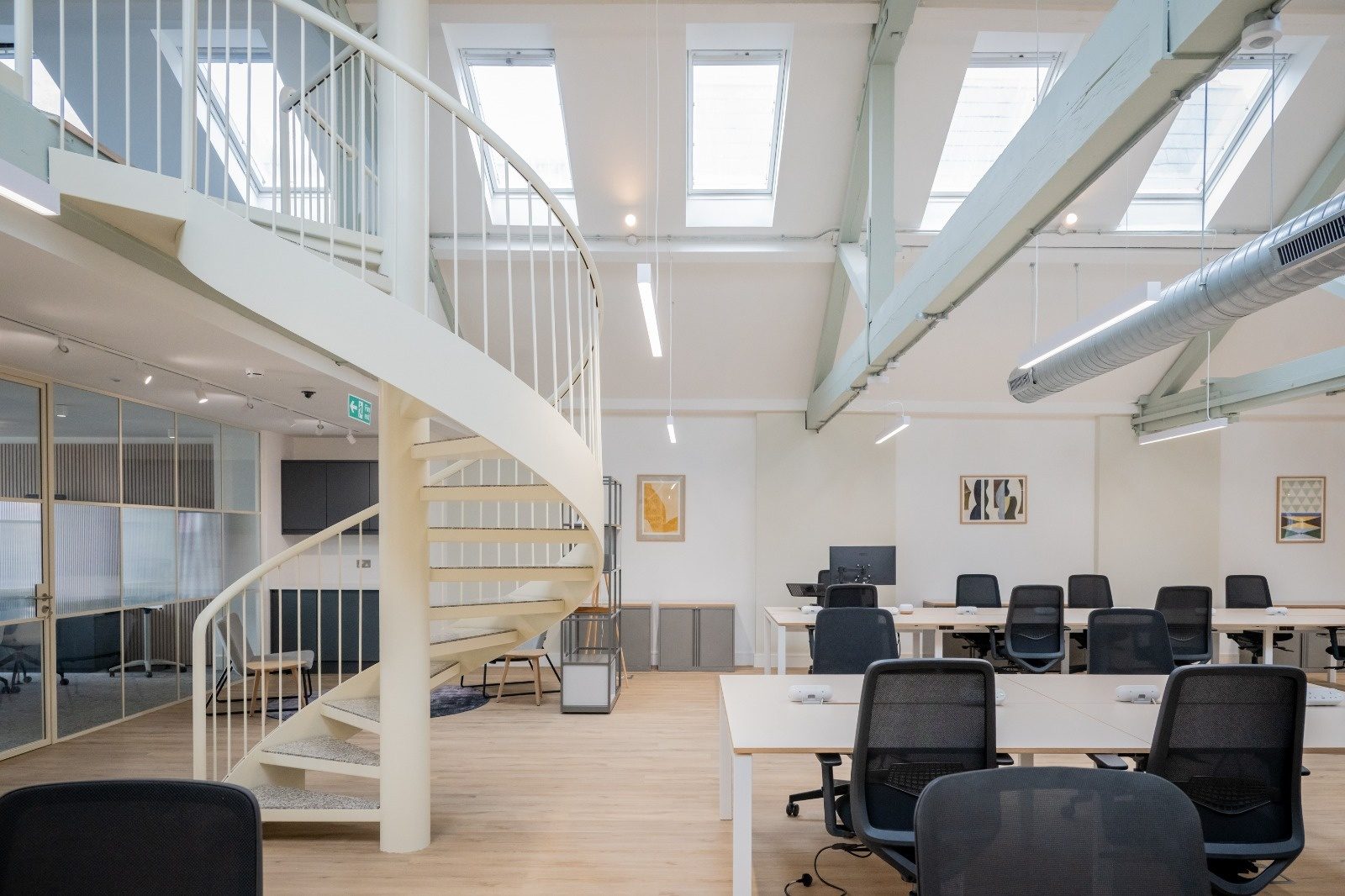 Office atrium lighting and containment installed at high level beneath skylights by Trace Electrical