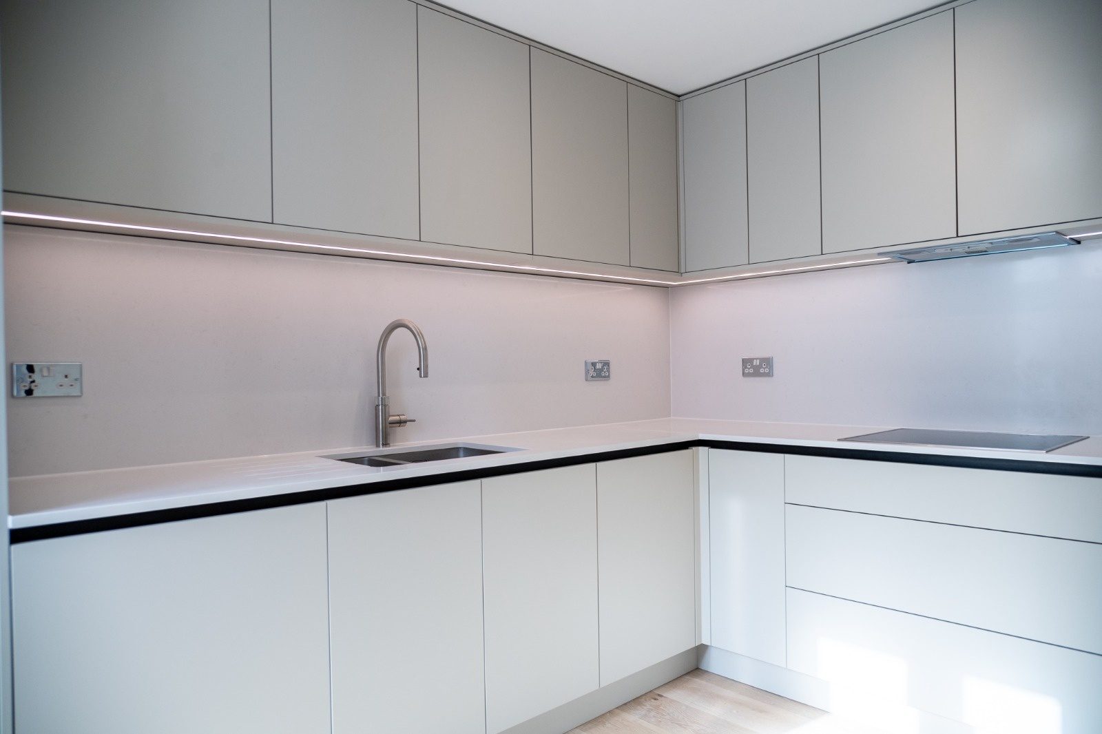 Newly wired kitchen with fresh socket outlets and under-cabinet LED lighting